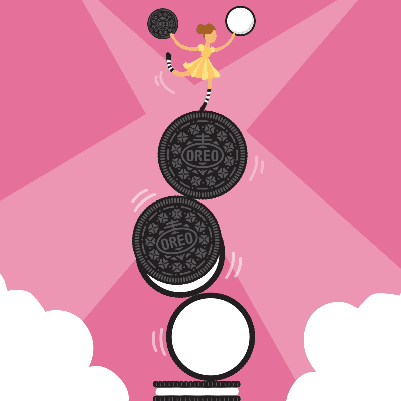 Oreo mascot building a snowman